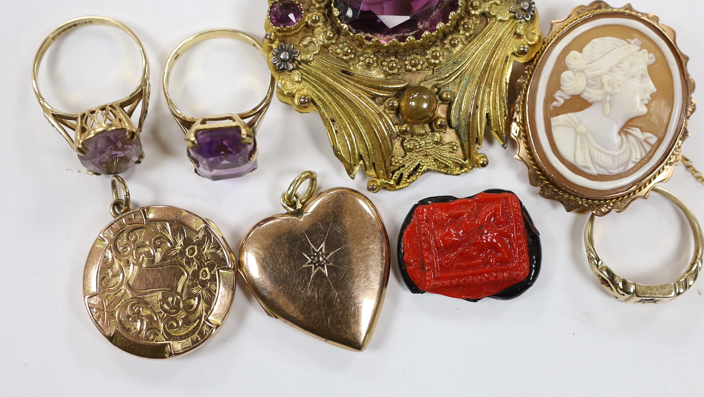 Three assorted 9ct gold and gem set rings including 1960's amethyst, a 9ct and oval cameo shell set brooch, a George V 9ct gold circular locket and three other items including diamond chip set heart shaped locket.